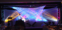 A conference room with multi-colored lights in the background