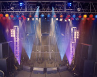 A small stage with blue, white and purple vertical spot lights